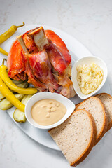 roasted pork knee with picked vegetables, bread and mustard