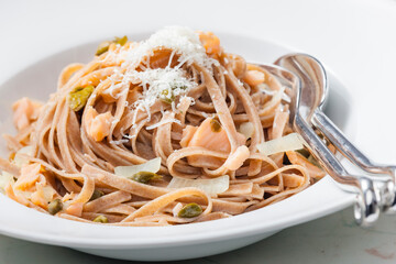 pasta tagliatelle with salmon, capers and parmesan cheese
