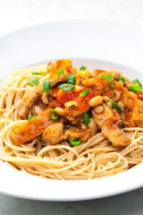 spaghetti with poultry meat, tomato sauce and beans