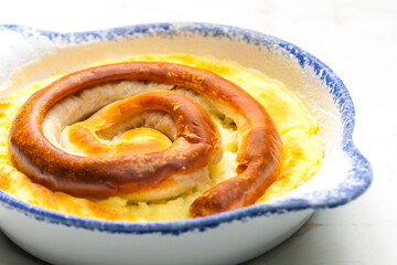 Obraz na płótnie Canvas sausage baked with mashed potatoes