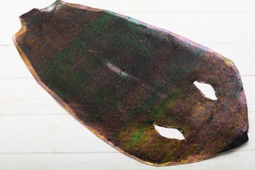 natural colored rays leather on the wooden table
