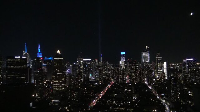 911 lights and the freedom tower on the top of Manhattan skyline