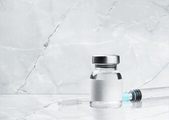 Syringe, vials of coronavirus vaccine.The concept of medicine, healthcare.
