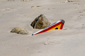 Traffic sign buried in the sand on the beach