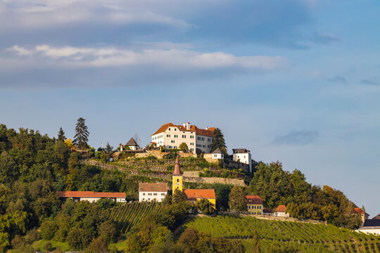 Kapfenstein castle and church with vineyard, Styria, Austria