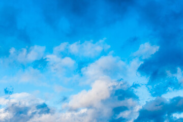 Blue sky texture with soft white clouds background