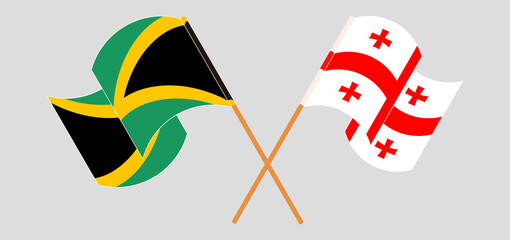 Crossed and waving flags of Jamaica and Georgia