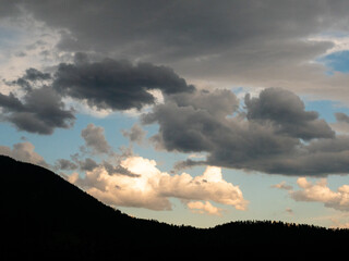 Mountain silhouette with beautiful sky of storm clouds.
