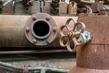 rusty pipes on a historic diesel engine