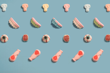 Halloween frame of party decorations on blue background.  Flat lay, top view. Happy Halloween holiday concept.