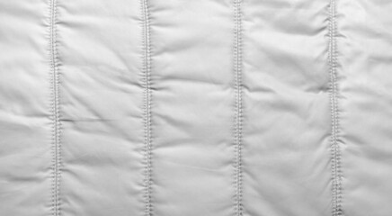 Bologna fabric seamed texture surface, white colored material. © breakermaximus