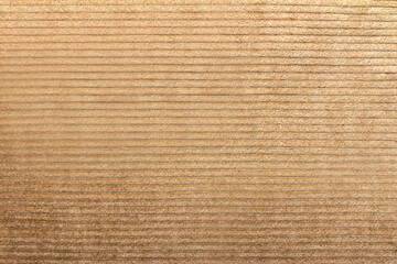 Texture backdrop photo of beige colored corduroy fabric cloth.