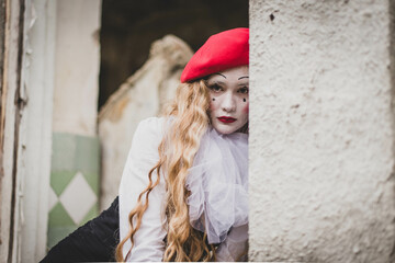 The girl with makeup of the mime. improvisation. Suit for Halloween. mime shows different emotions....