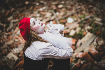 The girl with makeup of the mime. improvisation. Suit for Halloween. mime shows different emotions....
