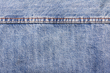 Texture backdrop photo of blue colored denim cloth.