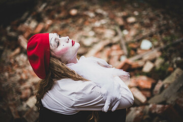 The girl with makeup of the mime. improvisation. Suit for Halloween. mime shows different emotions....
