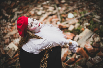 The girl with makeup of the mime. improvisation. Suit for Halloween. mime shows different emotions....