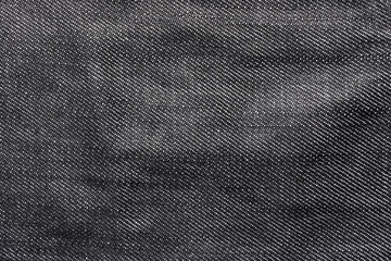 Texture backdrop photo of grey colored denim cloth.