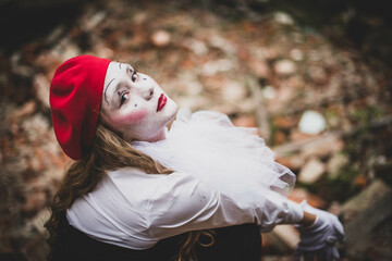 The girl with makeup of the mime. improvisation. Suit for Halloween. mime shows different emotions....