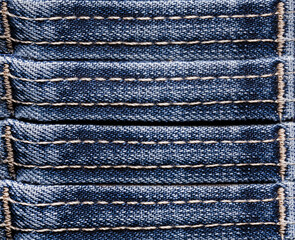 Texture backdrop photo of blue colored denim cloth stripes.