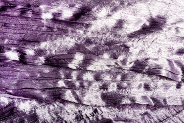 Texture backdrop photo of purple colored patterened satin cloth material.