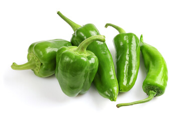 Raw green bell peppers in group, close-up isolated on white background