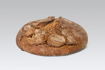 Round loaf of rye bread with an appetizing cracked crust