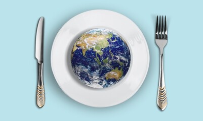 Globe on a plate for food. Power, economy, politics, globalism, hunger, poverty and world food...