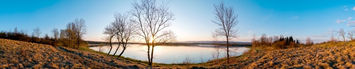Fototapeta na wymiar Panorama lake view in sunrise time .Sunrise at the lake