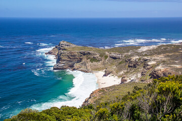 Fototapeta na wymiar Diaz Beach is seen from Cape Point, South Africa, at the tip where the Atlantic Ocean meets False Bay on a beautiful sunny day.