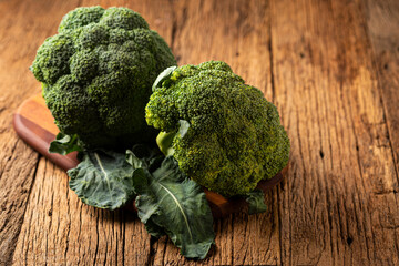 Green organic broccoli on the table.