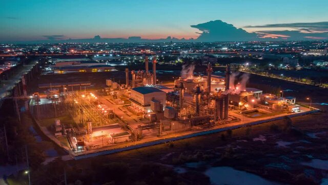 Aerial view Oil refinery. Industrial view at oil refinery plant form industry zone with sunrise and cloudy sky.
