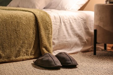 Male slippers on rug at home - obrazy, fototapety, plakaty