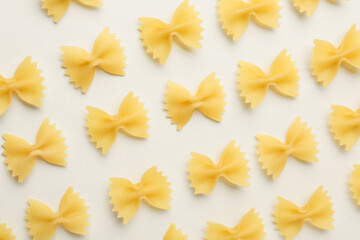 Uncooked farfalle pasta on light background