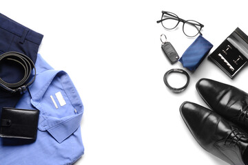Male clothes and set of stylish accessories on white background