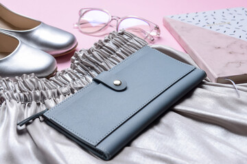 Stylish wallet and female accessories on table, closeup