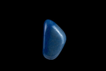 Close-up blue agate stone isolated on a black background.
