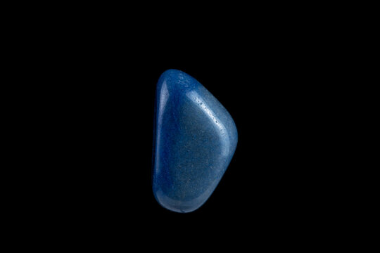 Close-up blue agate stone isolated on a black background.
