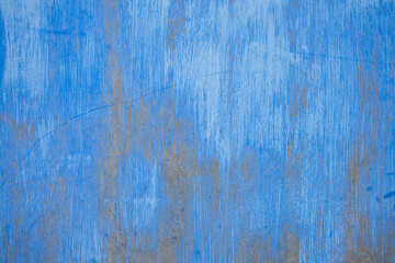 Fototapeta na wymiar Blue paint brush stroke on a wall surface, as abstract background.