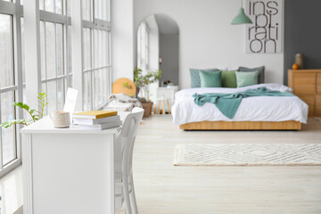 Modern workplace in interior of bedroom