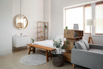 Interior of stylish bedroom with houseplants