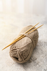 Knitting yarn and needles on table