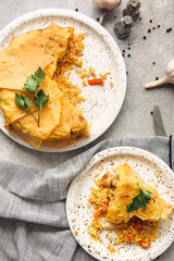 Plates with tasty Shah Pilaf on light background