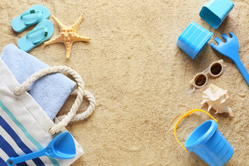Set of beach accessories for children, bag and towel on sand