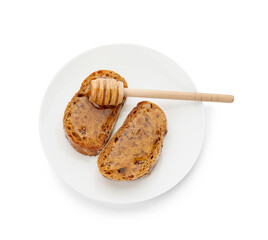 Plate with delicious toasted bread with honey on white background