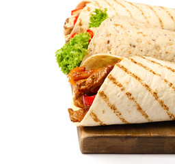 Wooden board with tasty Fajitas on white background, closeup