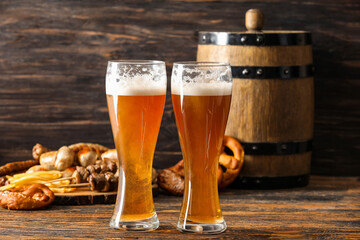 Glasses of fresh beer on wooden background. Oktoberfest celebration