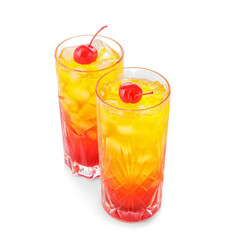 Glasses of tasty Tequila Sunrise cocktail on white background