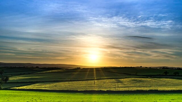 Sunset over the fields in Time Lapse Movie, Berry Pomeroy Village in Devon, England, Europe
