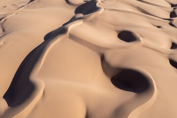 Wind-swept sand dunes, aerial view.